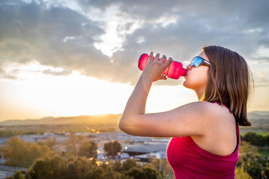 Runner drinking water